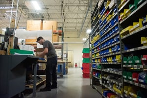a man packaging equipment for shipment